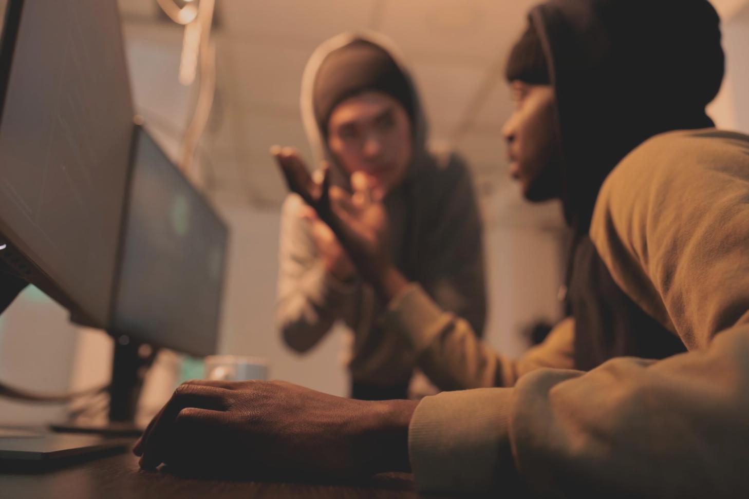 Students working on mobile app testing during hands-on training session